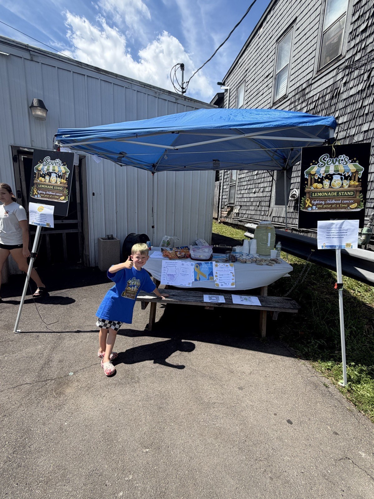 Sevi's full lemonade stand set up outside
